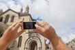© dvoevnore - Tourist taking photo of Perigueux, France