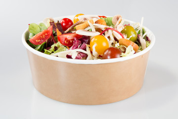 chinese Salad in carton takeaway container on white background