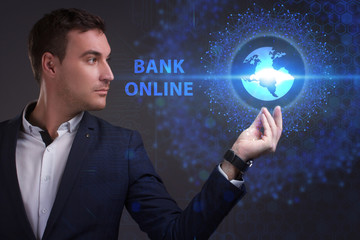 Business, Technology, Internet and network concept. Young businessman working on a virtual screen of the future and sees the inscription: Bank online