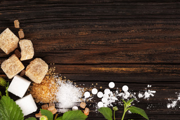 Wall Mural - Various types of sugar from above on wooden table.