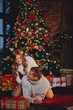 © viktoria_koks - Couple sitting at home on new year's Eve