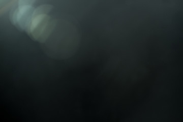 Wall Mural - real lens flare light effect. sparkle ray leak on black background. optical effect of spotlight. fla