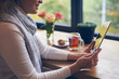 © ArtFamily - Mature lady using digital tablet