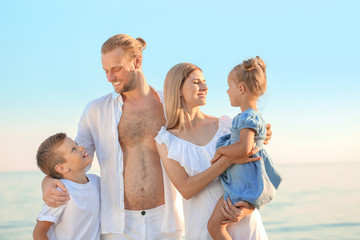 Canvas Print - Happy family on sea beach at resort