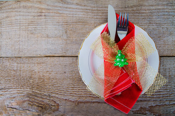 Wall Mural - cutlery into red towel on plate