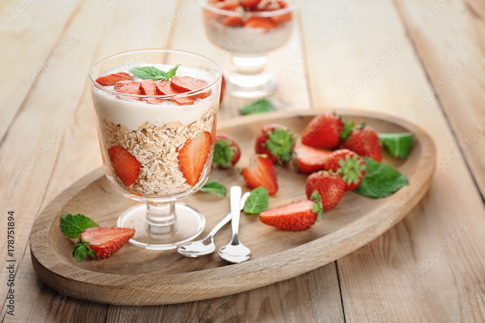 Delicious dessert with fresh strawberry on table