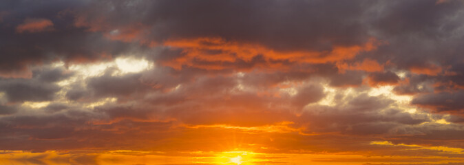 Wall Mural - fiery sunset, colorful clouds in the sky
