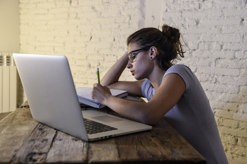 young student girl studying tired at home laptop computer preparing exam exhausted and frustrated feeling stress