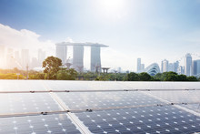 Solar Panel With Cityscape Of Modern City