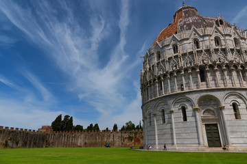 Wall Mural - Magnificent daily view at the Pisa Baptistery of St. John, the largest baptistery in Italy, in the Square of Miracles (Piazza dei Miracoli), Pisa, Italy.