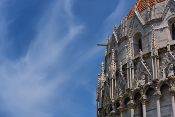 Wall Mural - Details of the exterior of the Pisa Baptistery of St. John, the largest baptistery in Italy, in the Square of Miracles (Piazza dei Miracoli), Pisa, Italy.