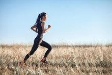 Asian Girl In Sportswear Running Across Field, Morning Workout