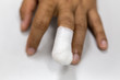 © sinhyu - Injured painful finger with white gauze bandage, hand injury,