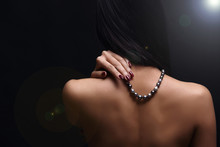 Portrait Of Beautiful Nude Long Straight Black Hair Woman With Pearl Necklace