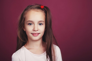 Cute girl on a red background