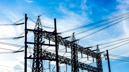 electric pole with blue sky and clouds