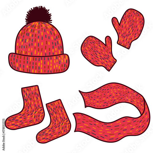 Cute winter wear on white background. Hat, mittens, socks and scarf