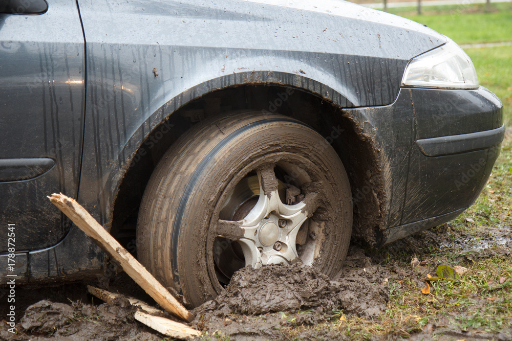 Poster tire road car wheel stuck in the wet mud Poster