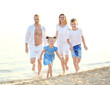 © Africa Studio - Happy family on sea beach at resort