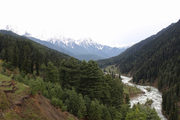 Glacier water flowing inside two mountain