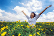 © Sirirat Makprasert - Happy woman enjoying in nature on sunflower garden on top of mountain cliff with sunrise; Beauty Girl Outdoor; Freedom concept.