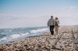 © LIGHTFIELD STUDIOS - senior couple walking on seashore