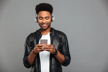 Wall Mural - Portrait of a smiling young afro american man