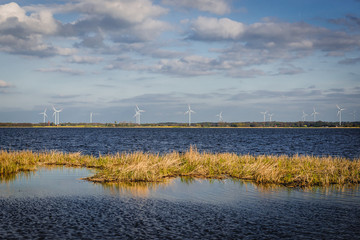 Poster - Wind farm over Resko Przymorskie coastal lake of the Baltic Sea in Poland