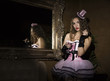© sandyche - Sexy cabaret woman in corset posing near mirror. Burlesque lingerie in fashion interior