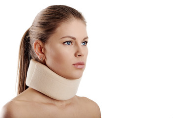 Close up of young female wearing neck collar on white background. Concept of osteoporosis or neck injury.  