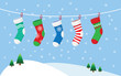 Christmas stockings for presents, hanging on a rope.