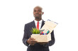 © Mediaphotos - Portrait of African office worker holding box with personal belongings