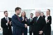 © ASDF - handshake of business partners after a business meeting in the office