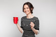 © Ivan Traimak - Picture of attractive woman in speckled clothes standing with cup in hands