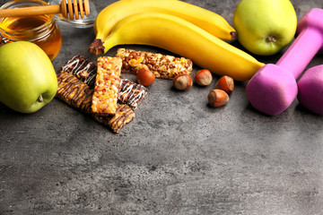 Wall Mural - Composition with cereal energy bars on grey background