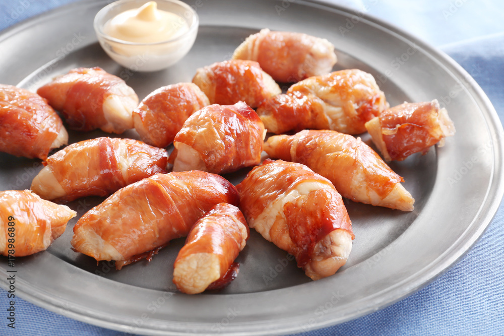 Bacon wrapped chicken on plate, closeup