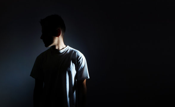 Fototapete - silhouette of man on black background, dark portrait, profile, male depression
