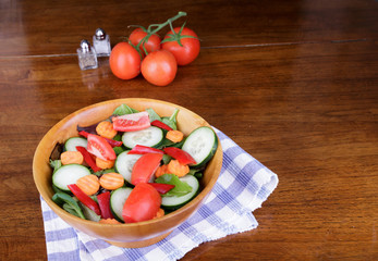 Wall Mural - Large Mixed Salad in Wood Bowl with Fresh Tomatoes