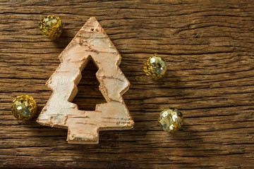 close up of christmas tree decoration with golden balls