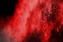 Abstract Red Powder Splash On Black Background.