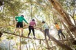 © WavebreakMediaMicro - Friends enjoying zip line adventure in park