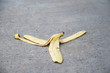 © Achisatha - Banana peel was left on the concrete floor. The danger may slip. If anyone walks on it.
