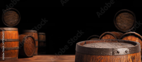 Fotografía Rustic wooden barrel on a night background