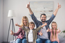Family Showing Thumbs Up