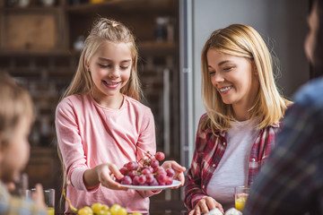 Wall Mural - mother and daughter having breakfast