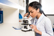 © LIGHTFIELD STUDIOS - Laboratory technician using microscope