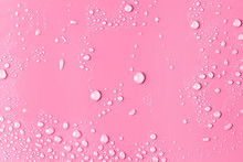 Close-up Of Water Drops On Pink Surface	
