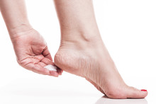 Care For Dry Skin On The Well-groomed Feet And Heels With Creams For The Skin And Feet