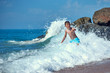 © Artem - Cute Caucasian boy in sea waves.