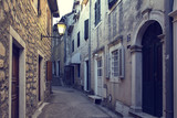 Fototapeta Uliczki - Old town narrow street and ancient houses. Herceg Novi, Montenegro.